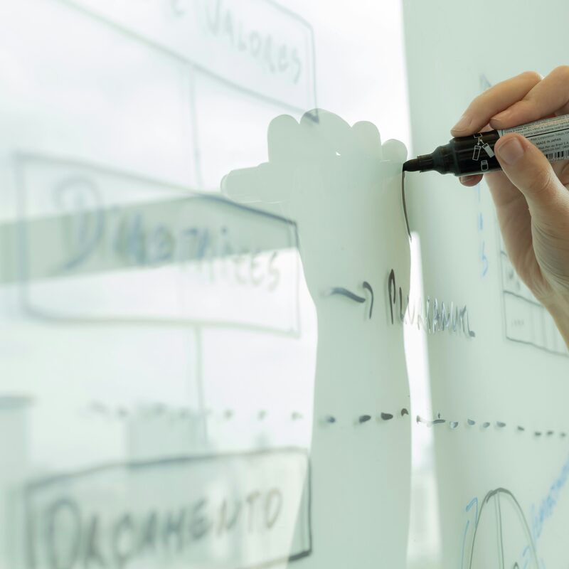 Developer sketching database schema on whiteboard — Photo by Beatriz Cattel on Unsplash